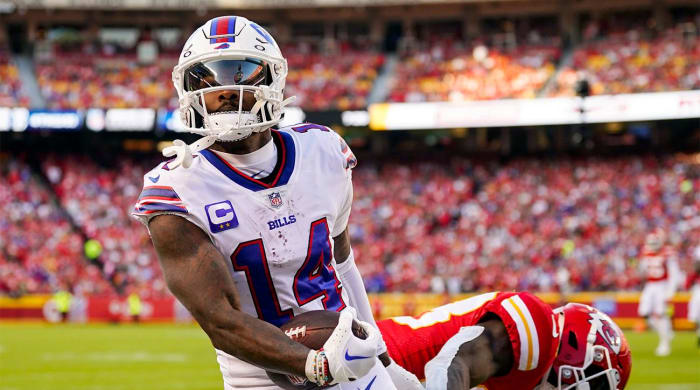 Oct 16, 2022; Kansas City, Missouri, USA; Buffalo Bills wide receiver Stefon Diggs (14) scores a touchdown against Kansas City Chiefs cornerback L’Jarius Sneed (38) during the second half at GEHA Field at Arrowhead Stadium.